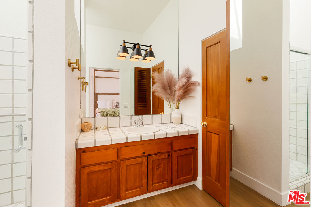 29221 Heathercliff Road, Unit 13 Malibu, CA 90265 - Photo 38 of 43 a bathroom with a sink and a mirror