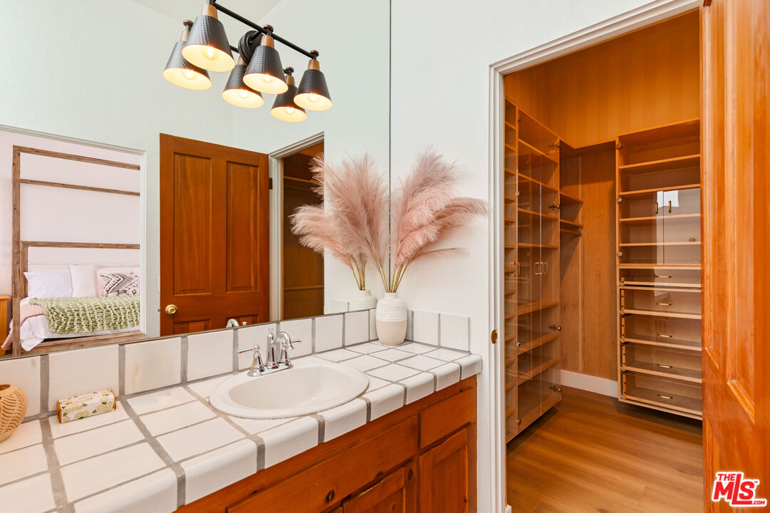 29221 Heathercliff Road, Unit 13 Malibu, CA 90265 - Photo 39 of 43 a bathroom with a sink and a mirror