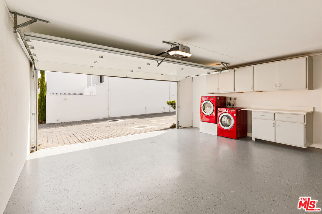 29221 Heathercliff Road, Unit 13 Malibu, CA 90265 - Photo 40 of 43 a view of a storage & utility room with a washer dryer
