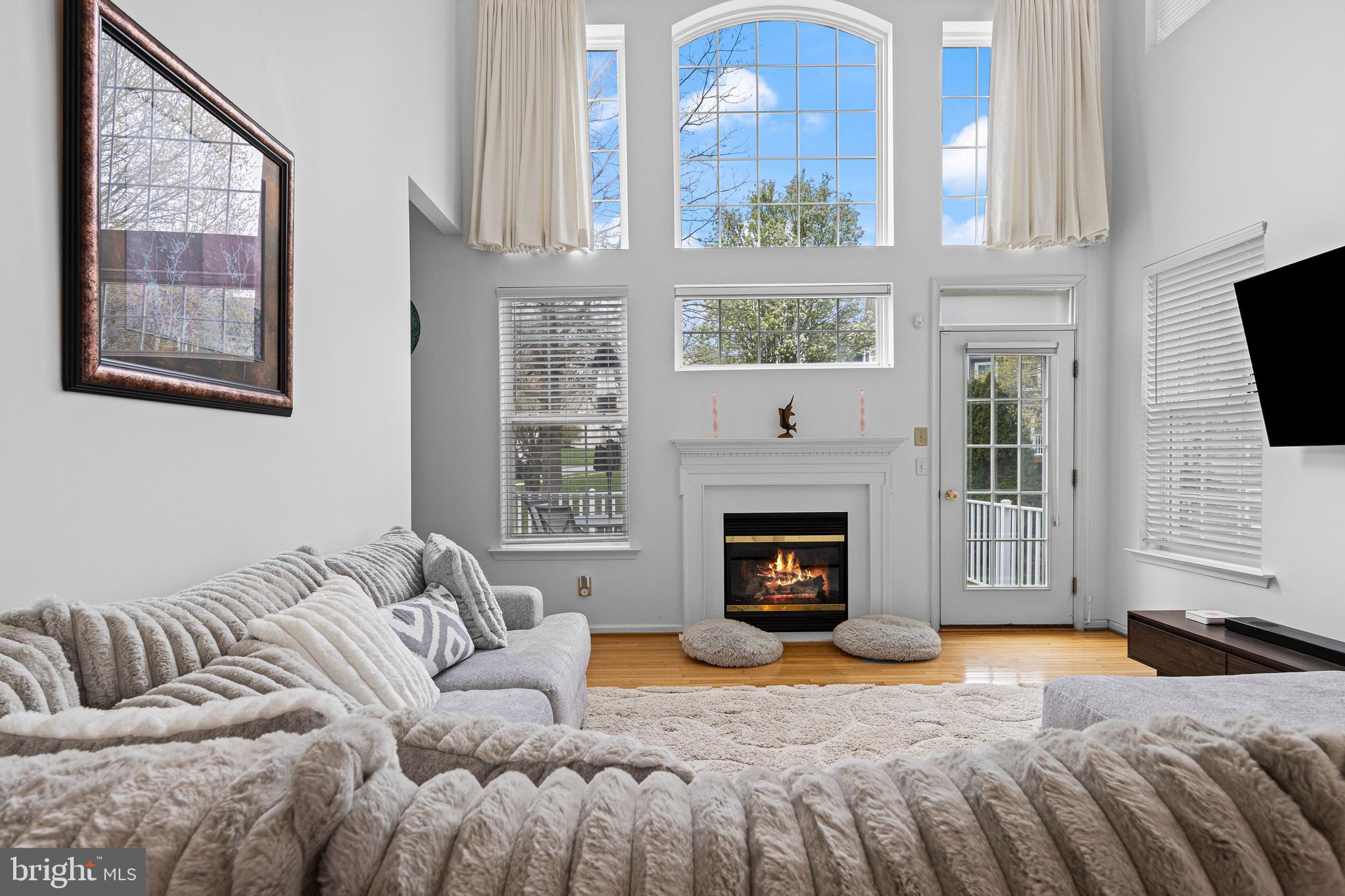 805 Hinchley Run West Chester, PA 19382 - Photo 24 of 53 a bedroom with a bed a fireplace and a flat tv screen