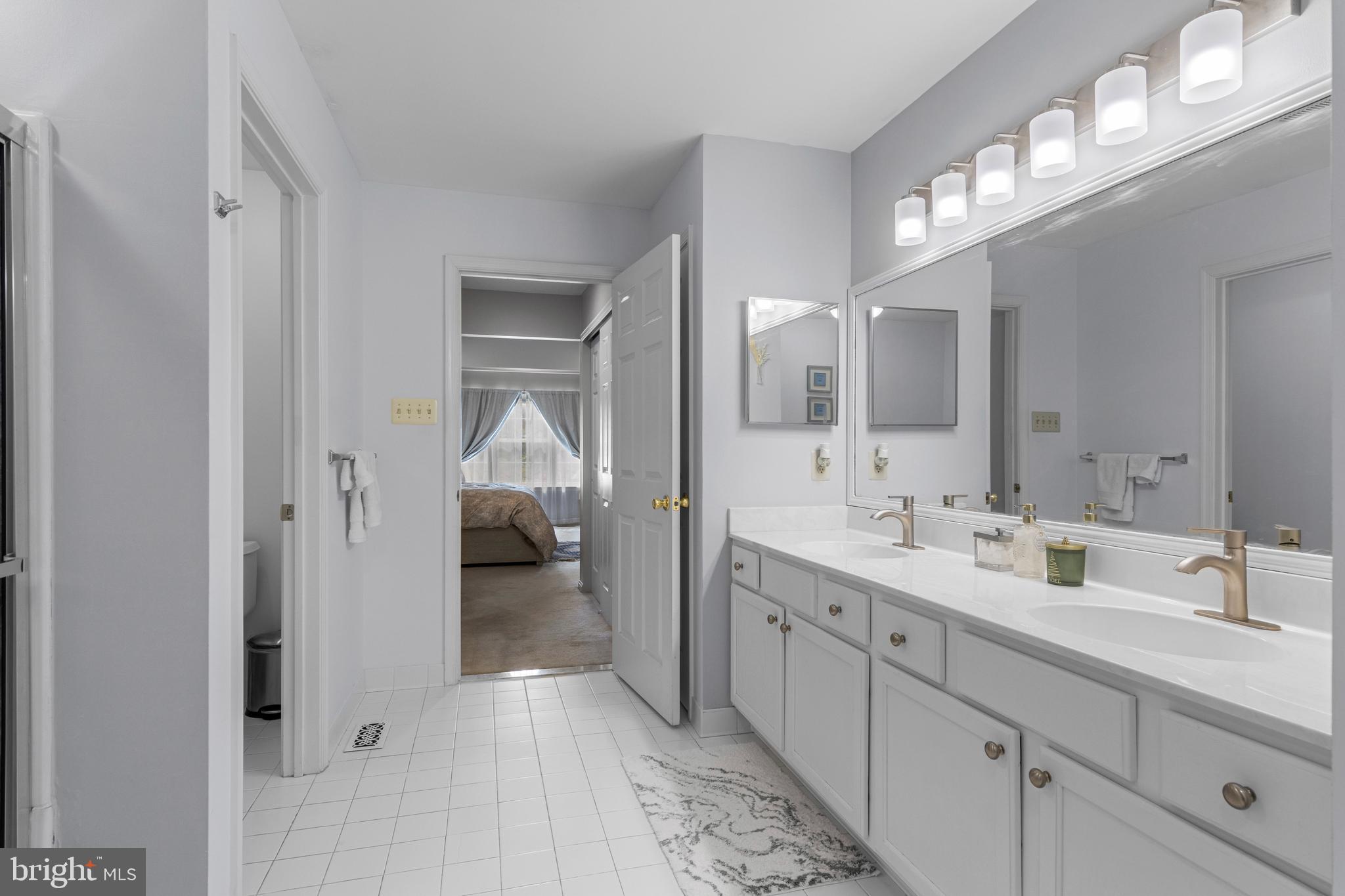 805 Hinchley Run West Chester, PA 19382 - Photo 45 of 53 a en suite bathroom with a double vanity sink and mirror