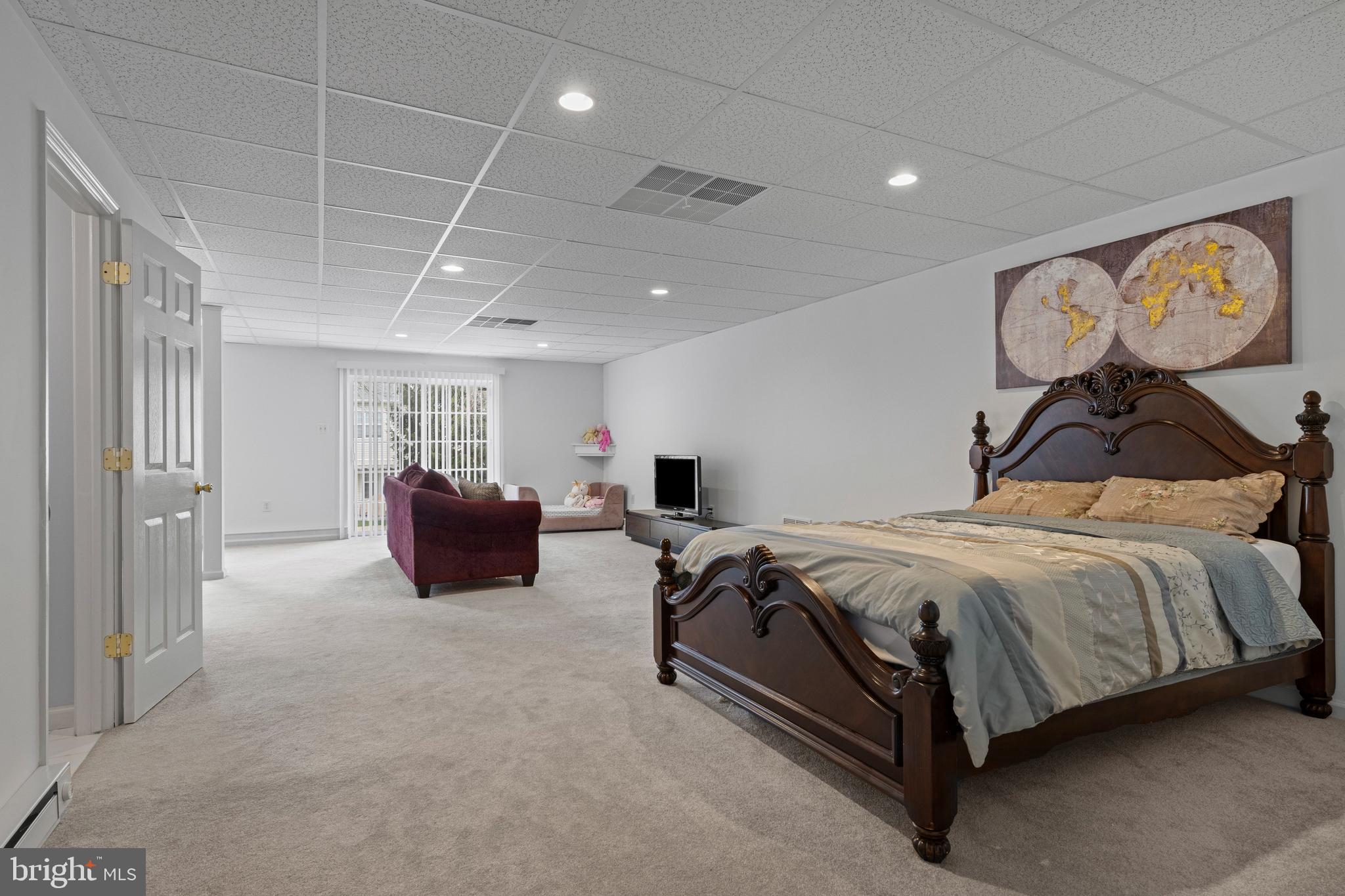 805 Hinchley Run West Chester, PA 19382 - Photo 47 of 53 a spacious bedroom with a bed and painting on the wall