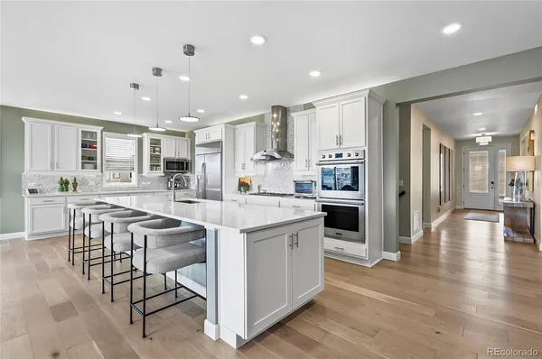 a kitchen with a table and chairs in it