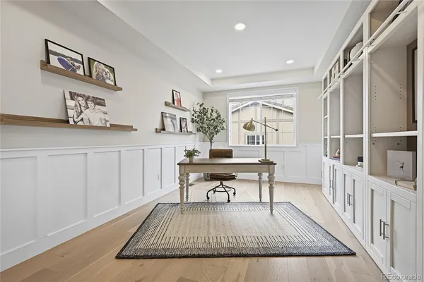 a living room with furniture a rug and a window