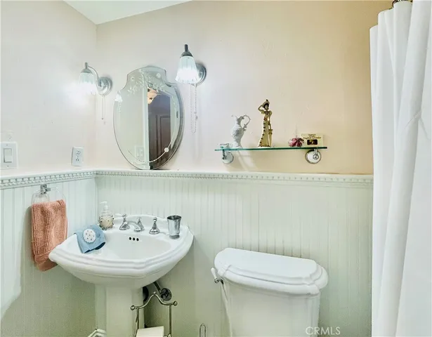 a view of a bathroom with sink and mirror