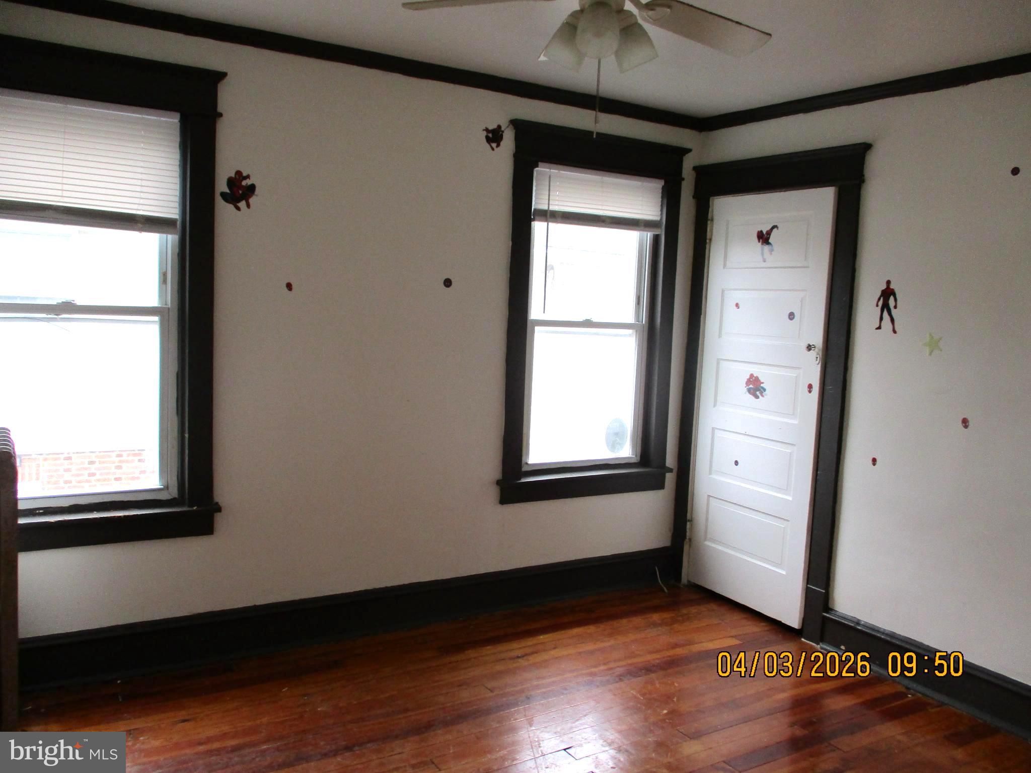 30 North Ridgeway Avenue Glenolden, PA 19036 - Photo 12 of 20 an empty room with wooden floor cabinet and windows