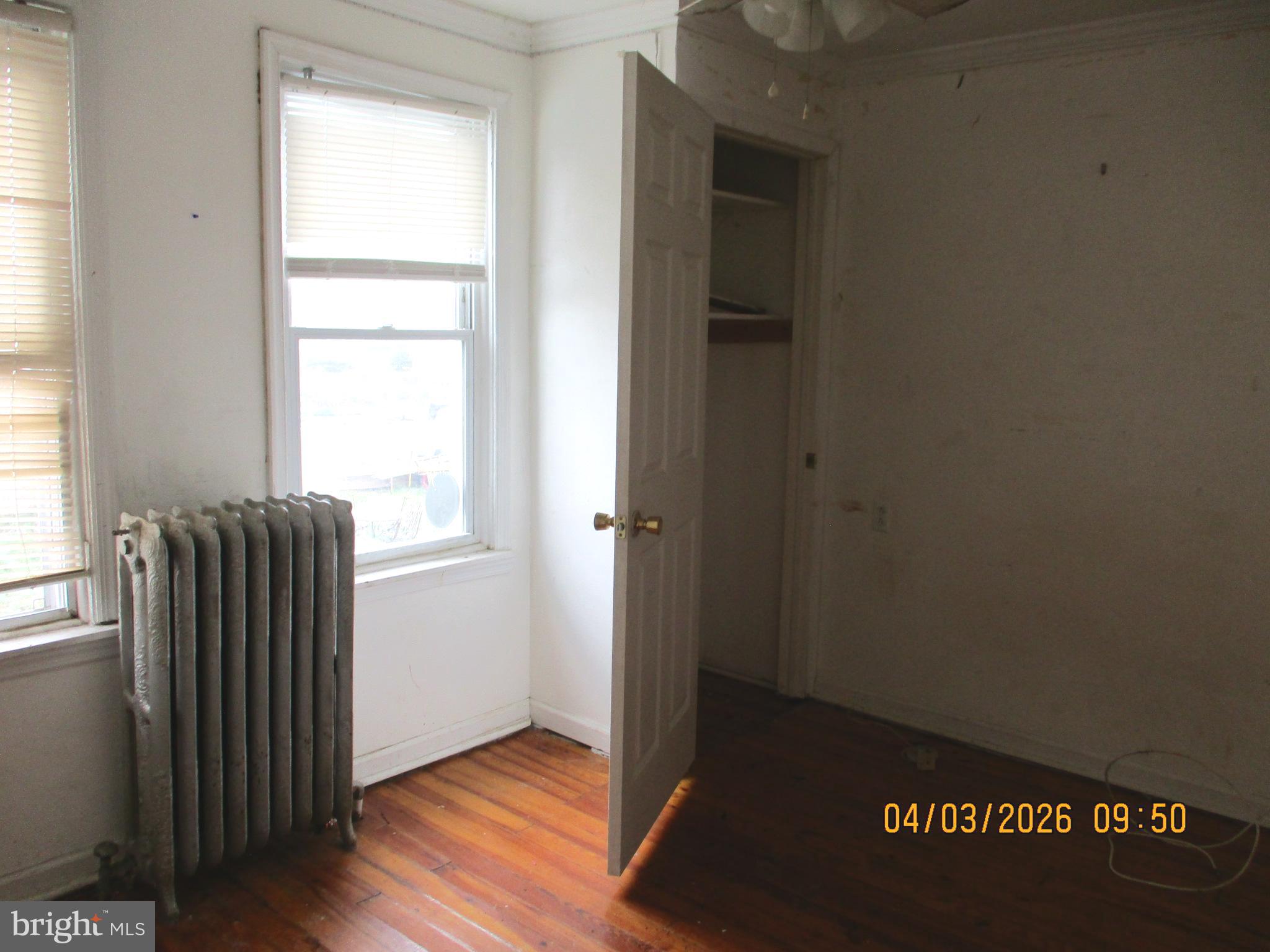 30 North Ridgeway Avenue Glenolden, PA 19036 - Photo 13 of 20 an empty room with wooden floor and windows