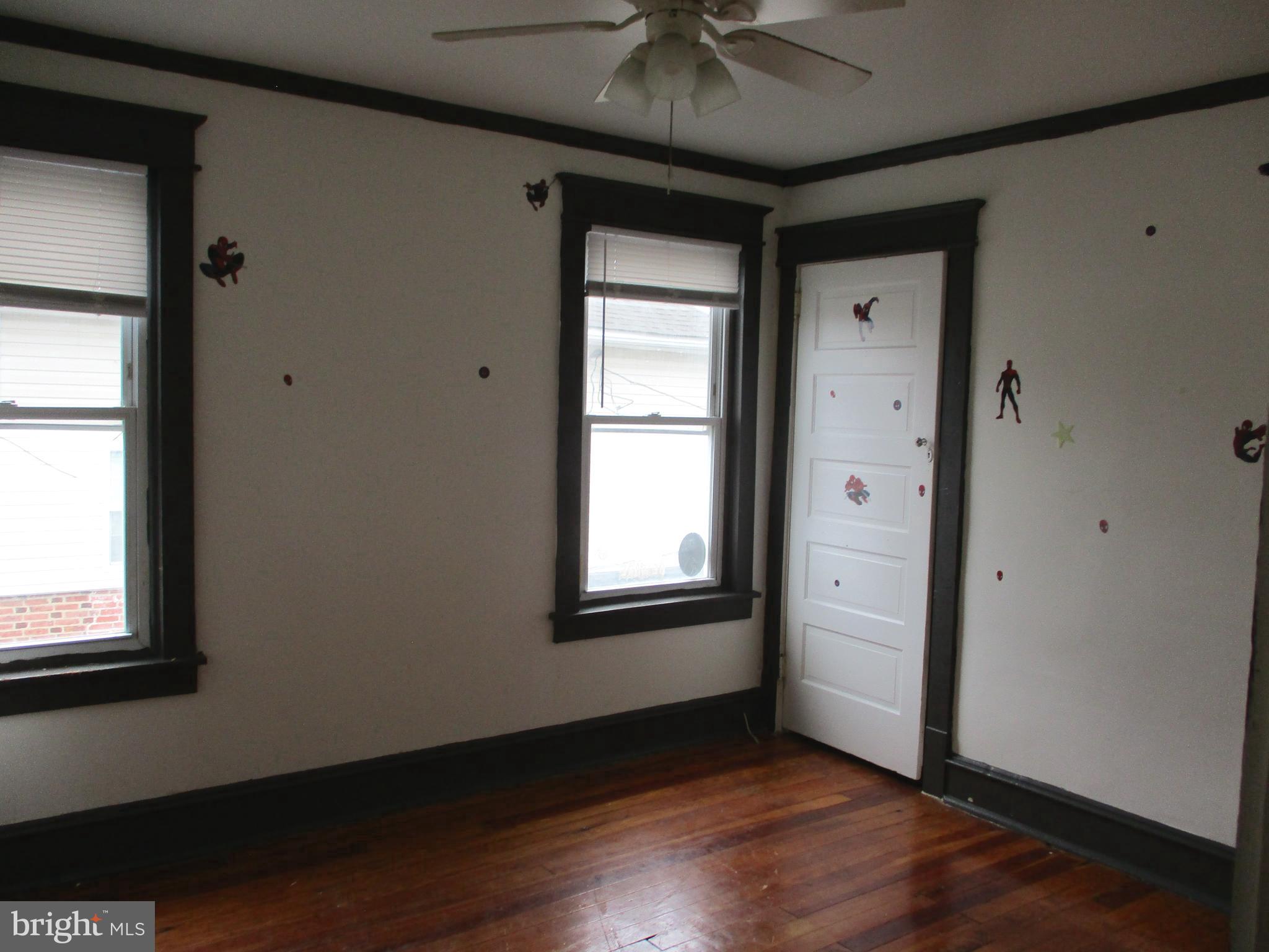 30 North Ridgeway Avenue Glenolden, PA 19036 - Photo 16 of 20 an empty room with wooden floor and windows