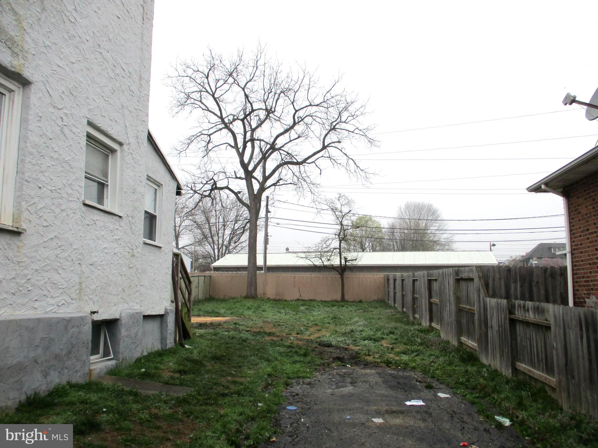 30 North Ridgeway Avenue Glenolden, PA 19036 - Photo 18 of 20 a view of a backyard with plants and large trees