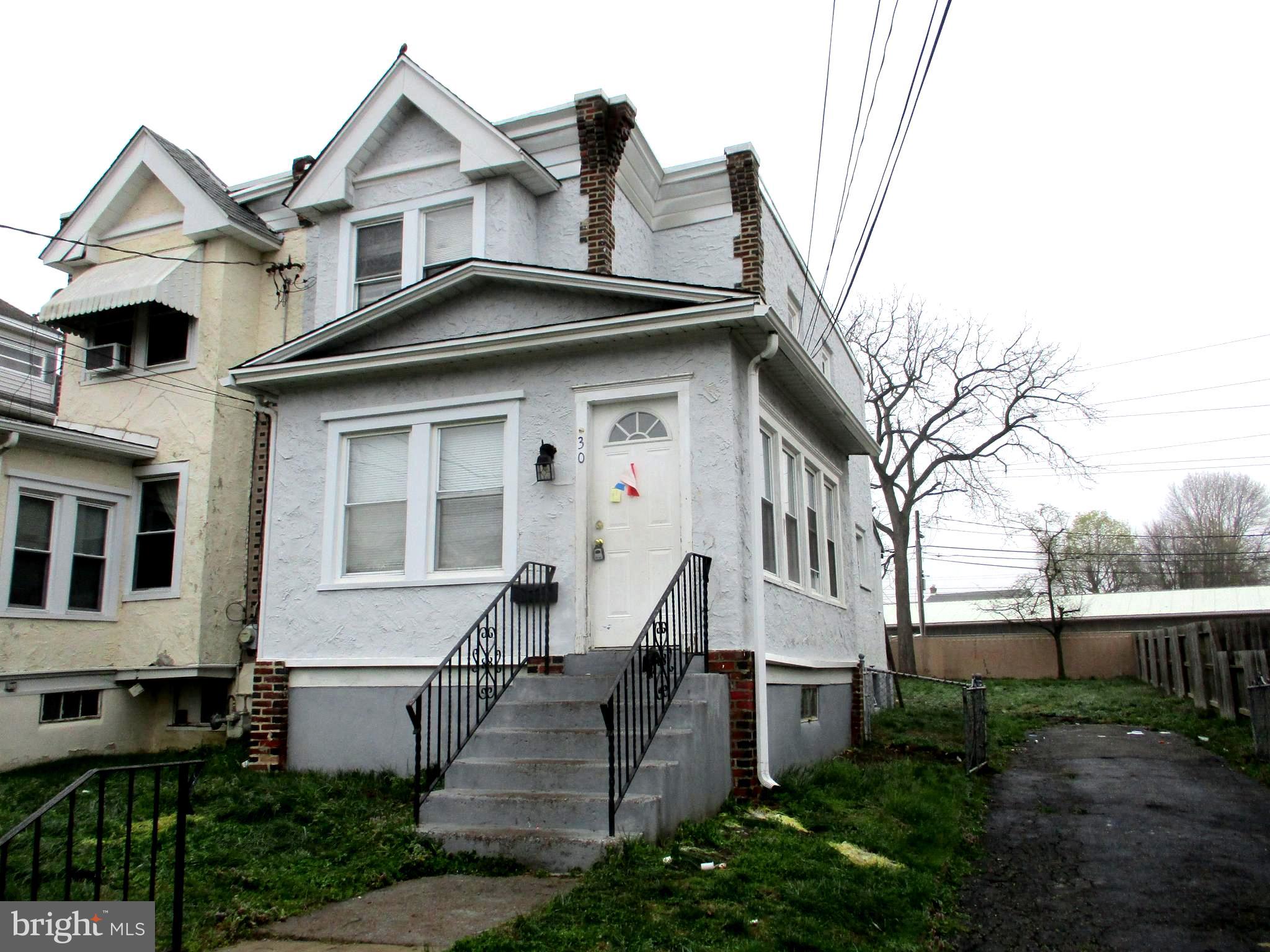 30 North Ridgeway Avenue Glenolden, PA 19036 - Photo 2 of 20 a front view of a house with a yard
