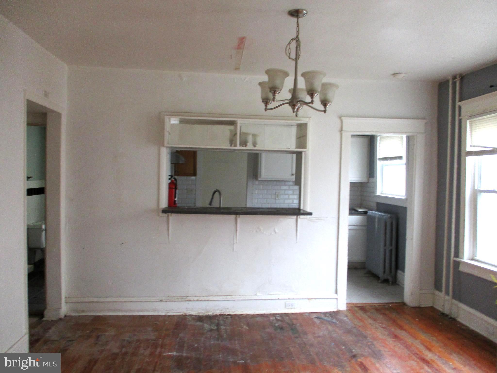 30 North Ridgeway Avenue Glenolden, PA 19036 - Photo 6 of 20 a view of a kitchen with a sink and dishwasher a refrigerator with wooden floor
