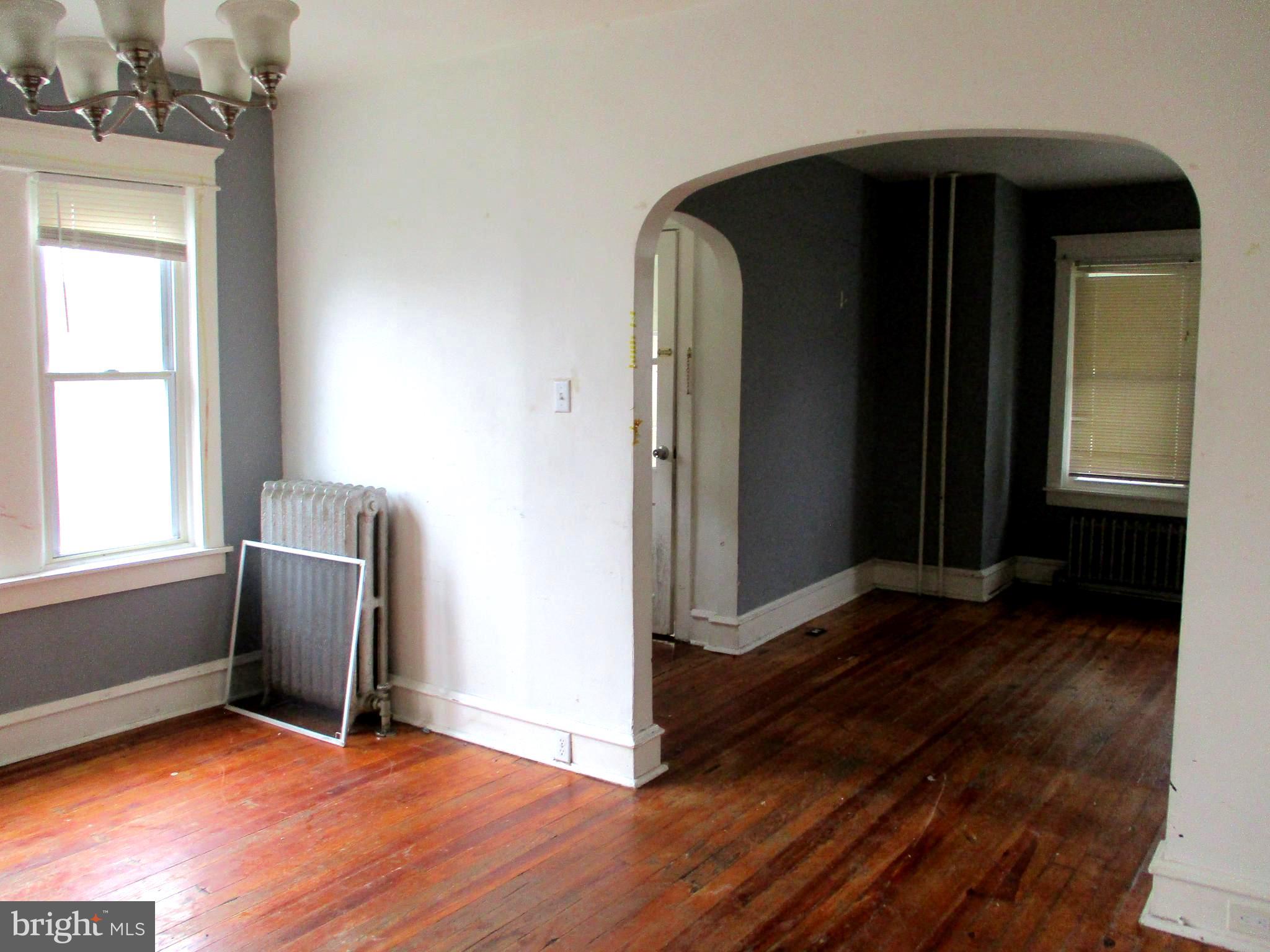 30 North Ridgeway Avenue Glenolden, PA 19036 - Photo 7 of 20 a view of a livingroom with wooden floor and a window