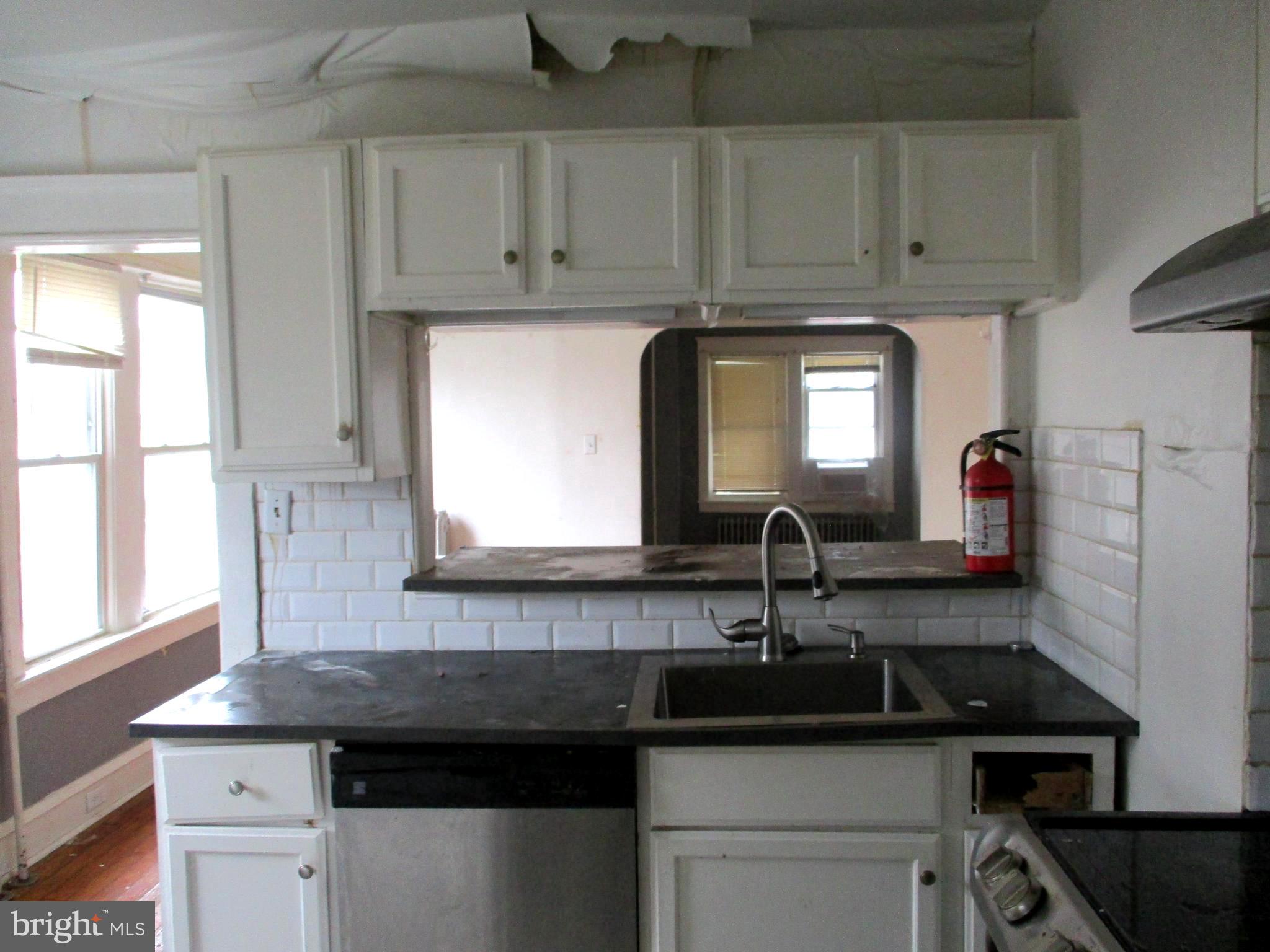 30 North Ridgeway Avenue Glenolden, PA 19036 - Photo 9 of 20 a kitchen with stainless steel appliances granite countertop a sink stove and cabinets