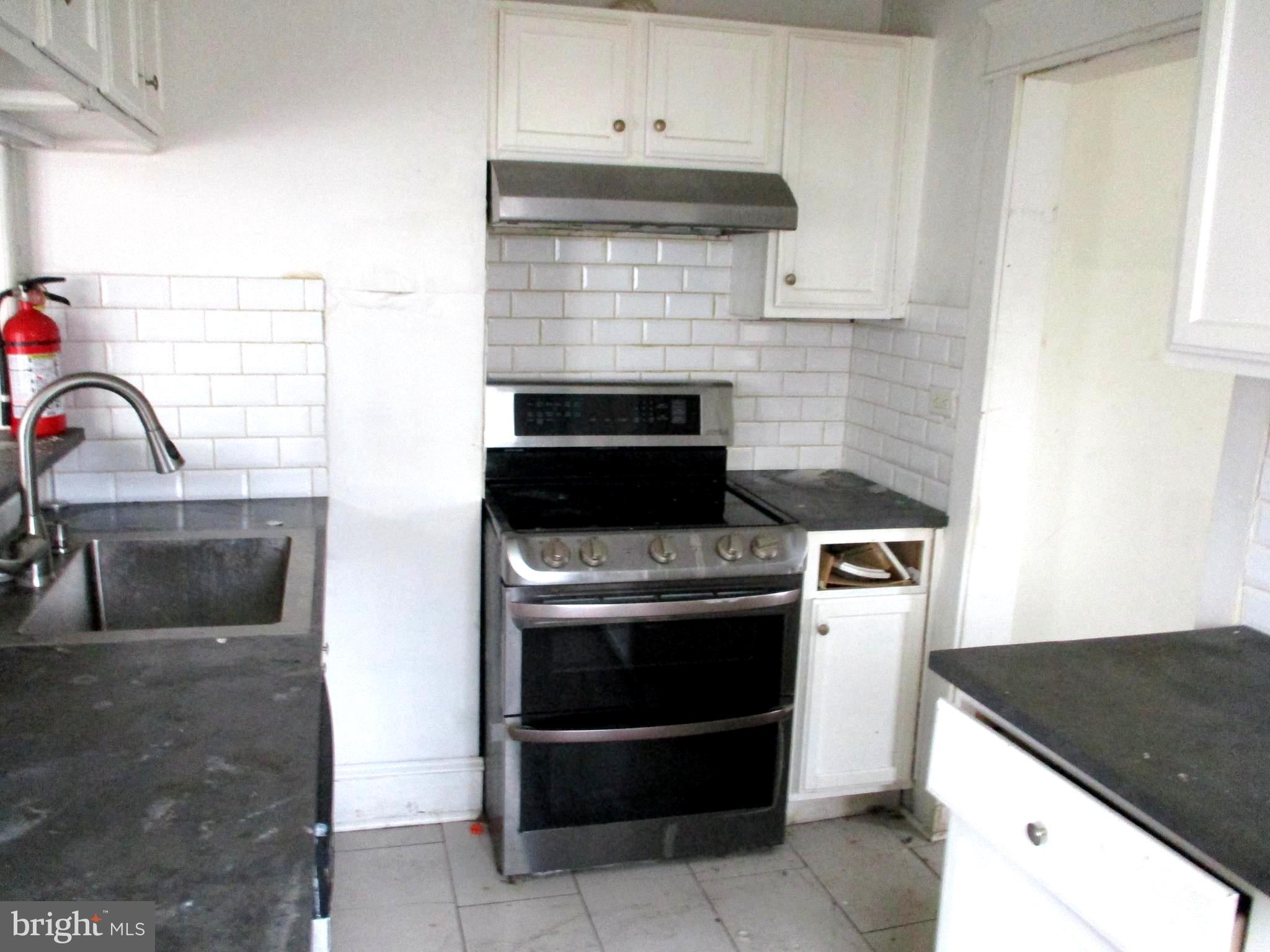 30 North Ridgeway Avenue Glenolden, PA 19036 - Photo 10 of 20 a kitchen with a stove and a sink