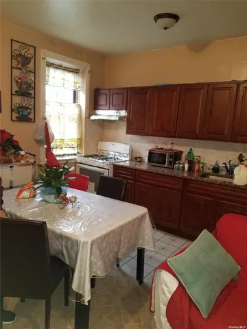 a kitchen with a sink cabinets and window