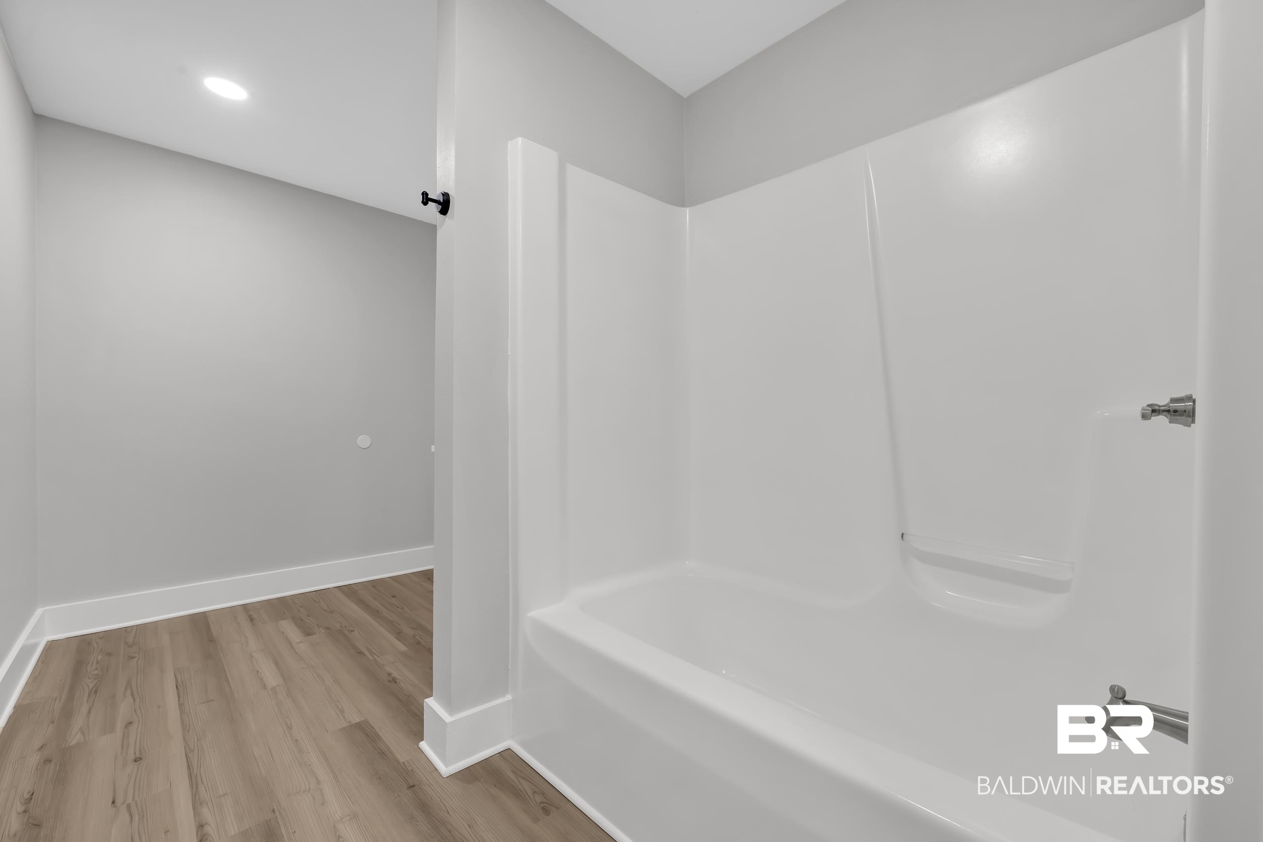 8351 Theodore Dawes Road Theodore, AL 36582 - Photo 22 of 46 Bathroom featuring light wood-style floors, bathtub / shower combination, and recessed lighting