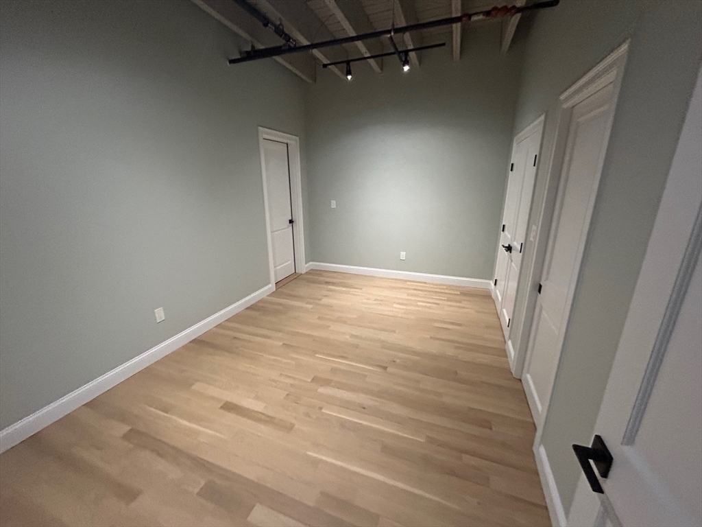 199 Market Street, Unit 1 Lowell, MA 01852 - Photo 5 of 8 a view of a room with an empty space