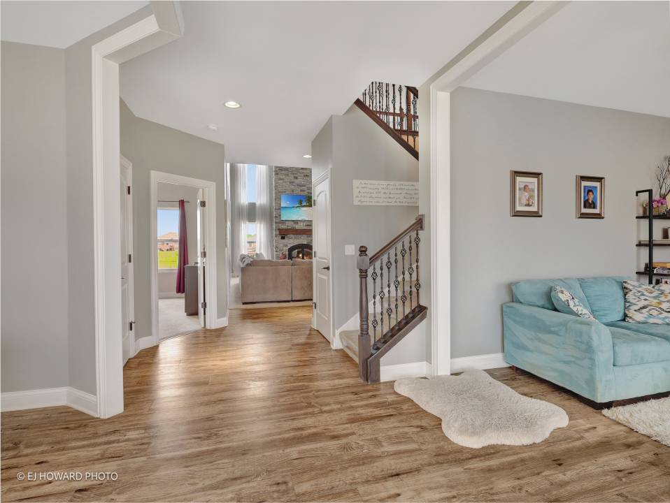 16308 Palomino Path Manhattan, IL 60442 - Photo 11 of 39 a view of a livingroom with wooden floor and furniture