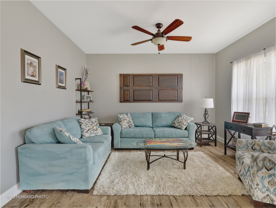 16308 Palomino Path Manhattan, IL 60442 - Photo 12 of 39 a living room with furniture and a ceiling fan