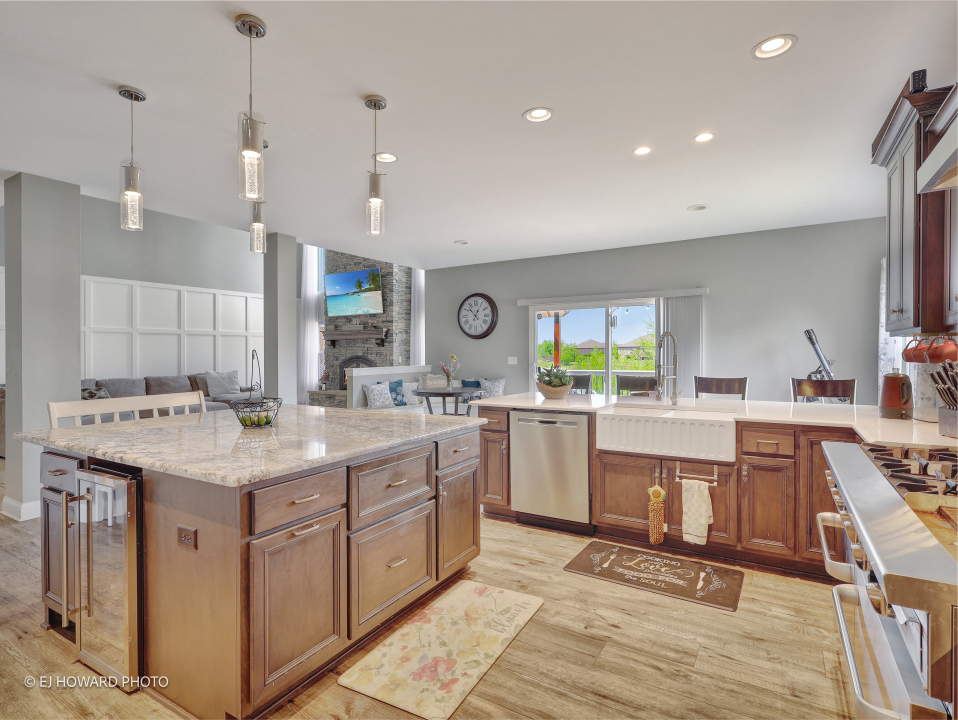 16308 Palomino Path Manhattan, IL 60442 - Photo 18 of 39 a kitchen with a sink stove and cabinets