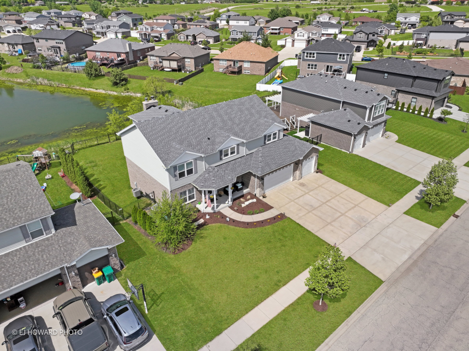 16308 Palomino Path Manhattan, IL 60442 - Photo 2 of 39 an aerial view of a house with garden space and ocean view