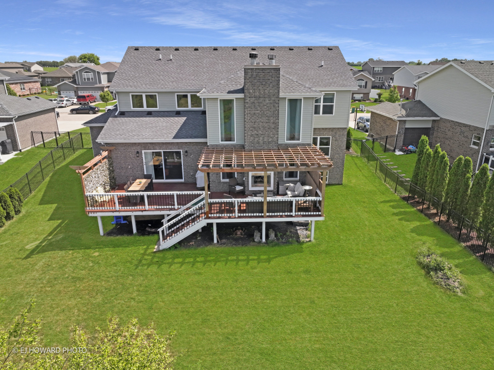 16308 Palomino Path Manhattan, IL 60442 - Photo 6 of 39 an aerial view of a house with swimming pool garden and patio