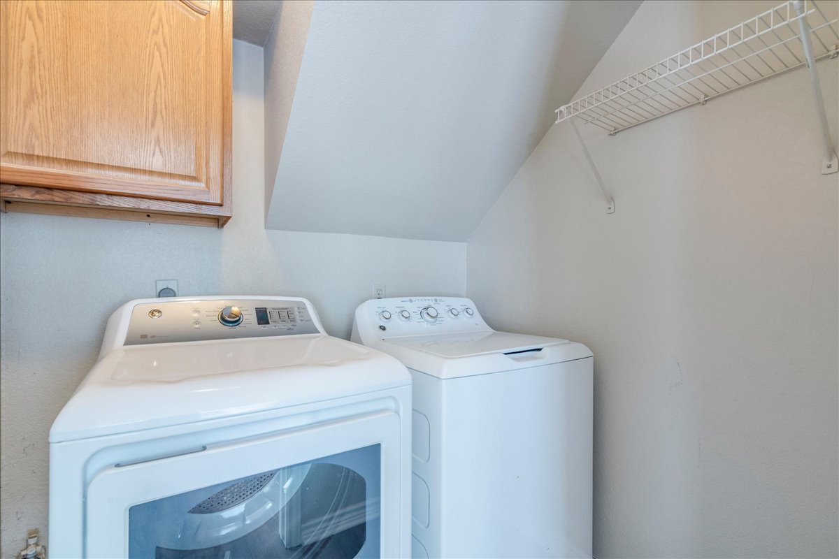9300 Tea Rose Trail Austin, TX 78748 - Photo 28 of 33 A dedicated laundry space provides practical, in-home convenience with overhead cabinetry.