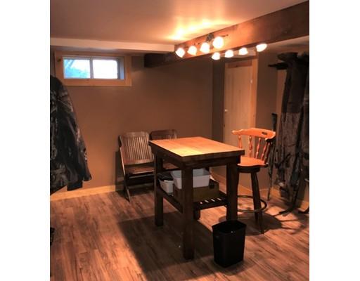 219 Marion Road Rochester, MA 02770 - Photo 17 of 20 a view of a dining room with furniture and wooden floor