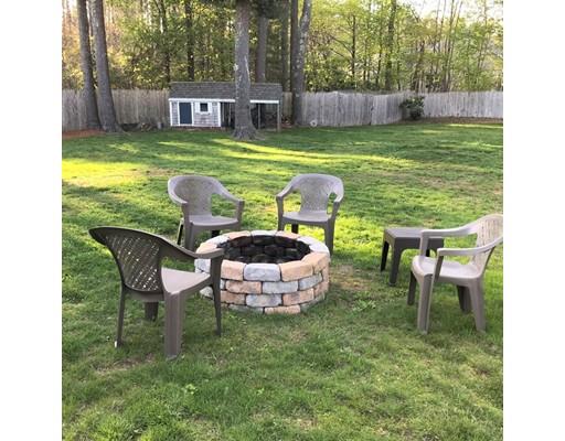 219 Marion Road Rochester, MA 02770 - Photo 20 of 20 a view of a chair and table in the garden