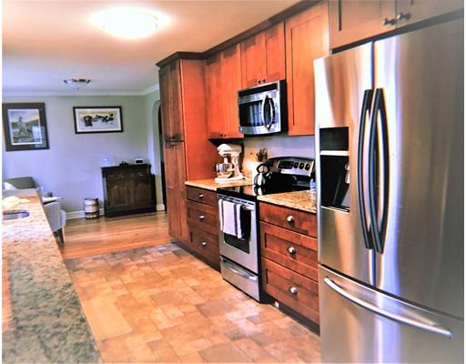 219 Marion Road Rochester, MA 02770 - Photo 4 of 20 a kitchen with stainless steel appliances granite countertop a refrigerator stove and sink