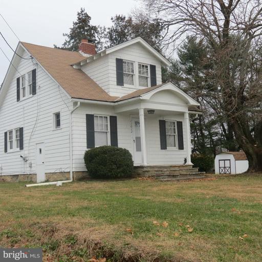 11012 Liberty Road Randallstown, MD 21133 - Photo 1 of 1 a front view of a house with a garden