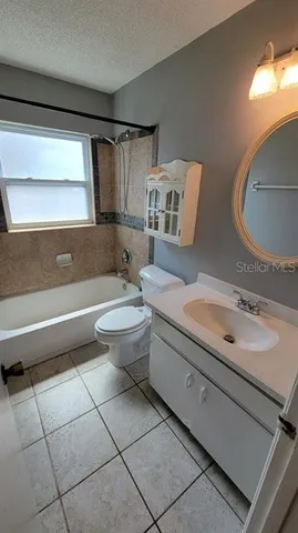 a bathroom with a sink toilet and a mirror