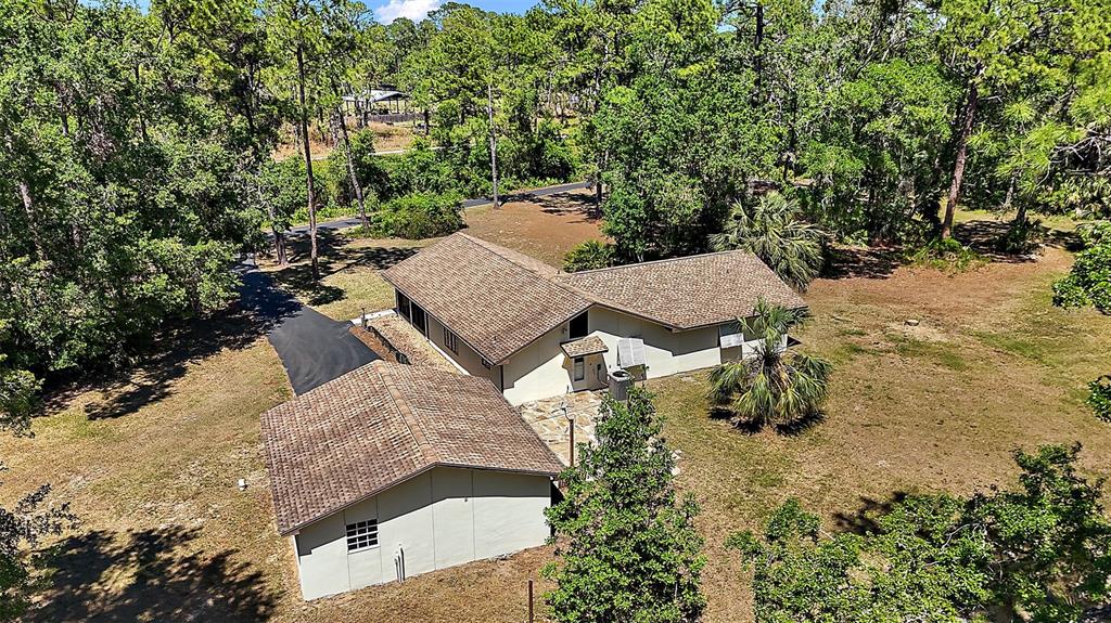 40325 Emeralda Island Road Leesburg, FL 34788 - Photo 32 of 35 Aerial of cleared area around home ~