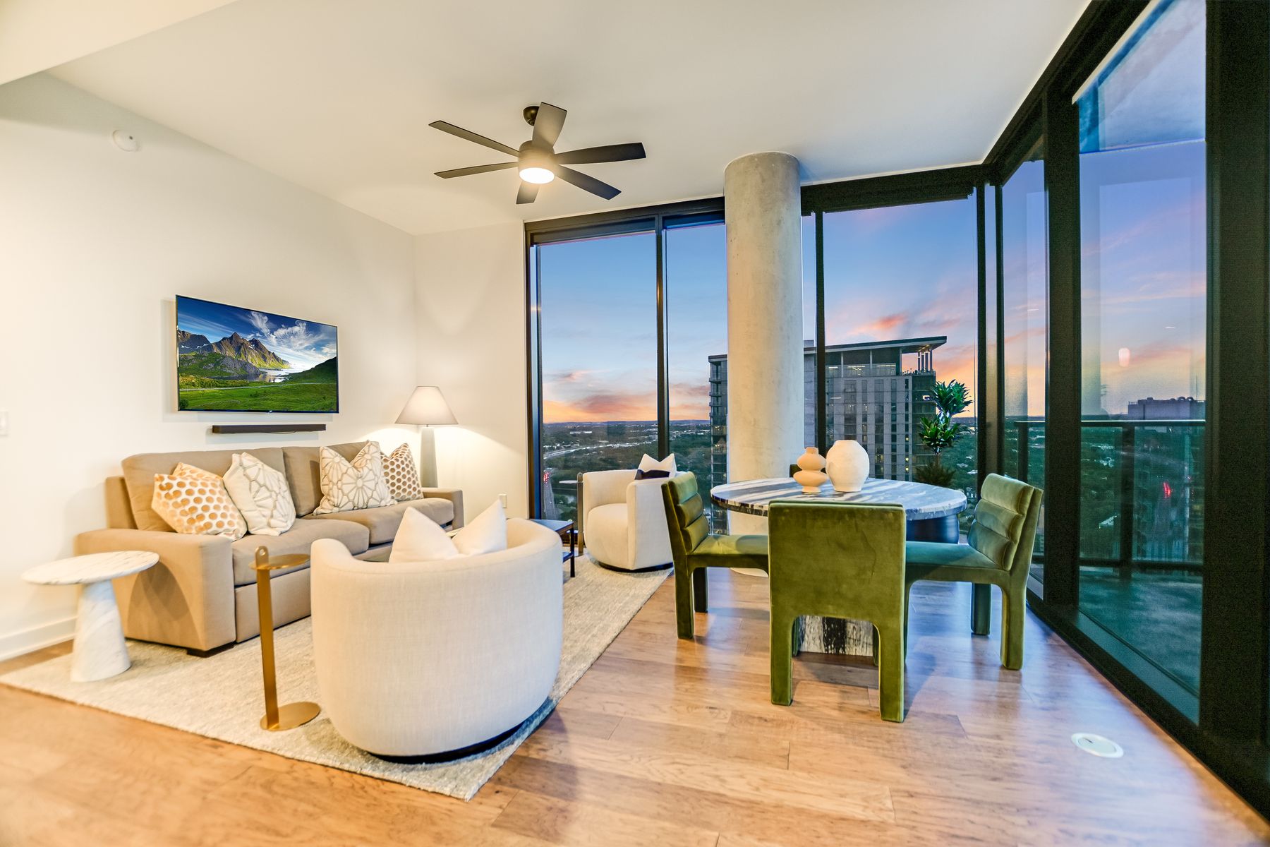 84 East Avenue, Unit 3909 Austin, TX 78701 - Photo 3 of 26 Living area with wood finished floors, floor to ceiling windows, and ceiling fan