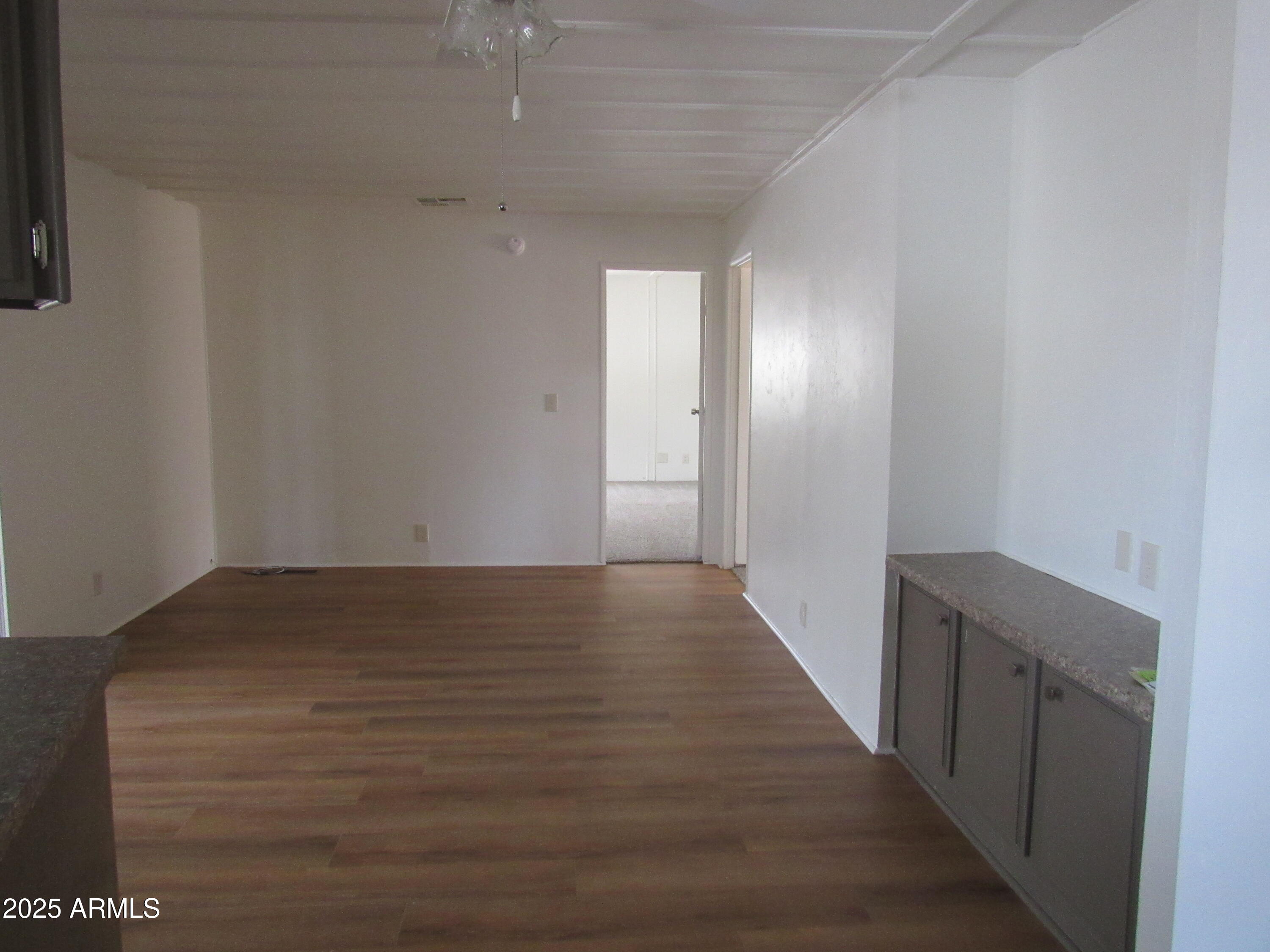 3411 South Camino Seco, Unit 70 Tucson, AZ 85730 - Photo 14 of 22 a view of hallway with wooden floor