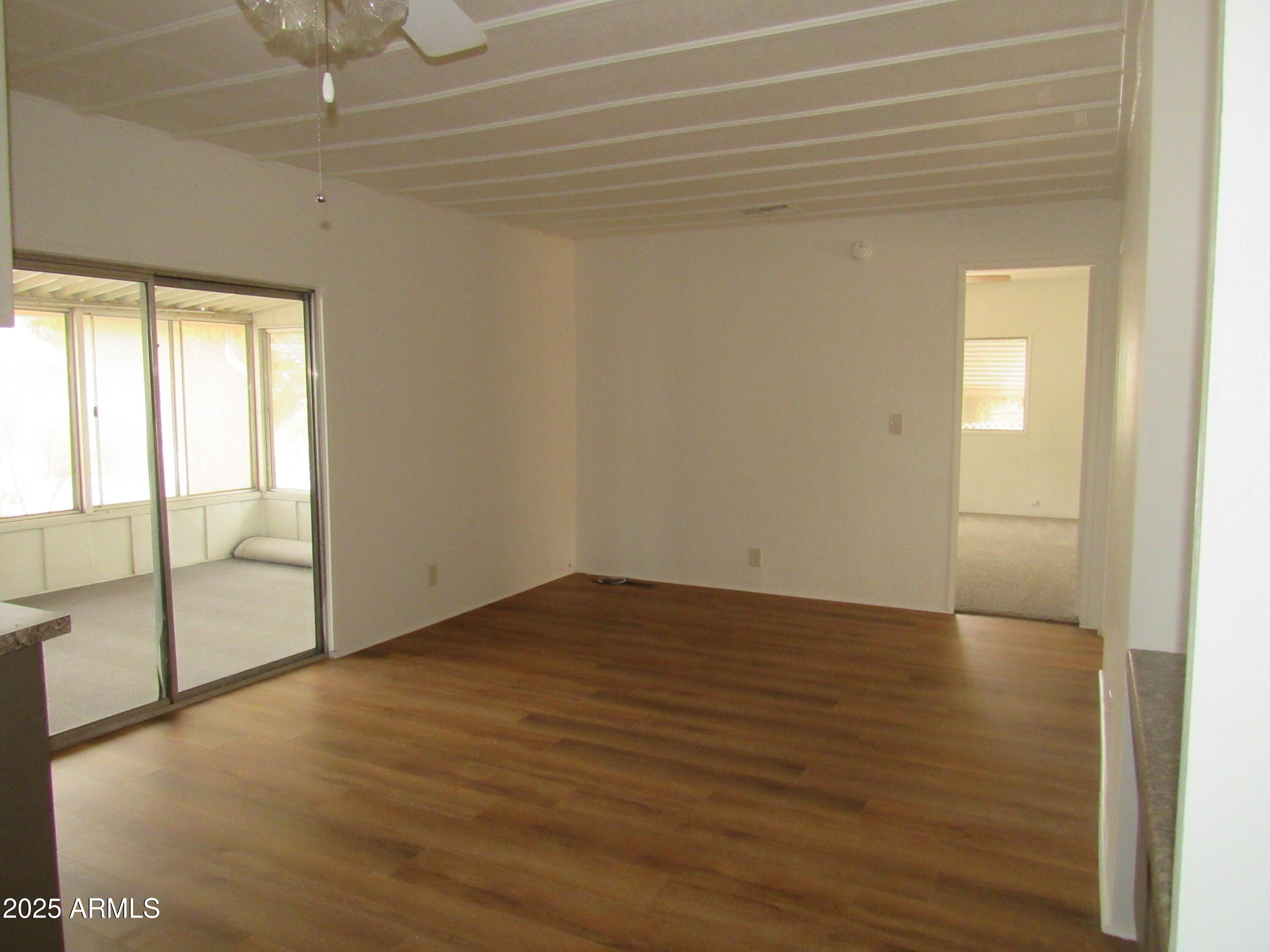3411 South Camino Seco, Unit 70 Tucson, AZ 85730 - Photo 15 of 22 a view of an empty room and window