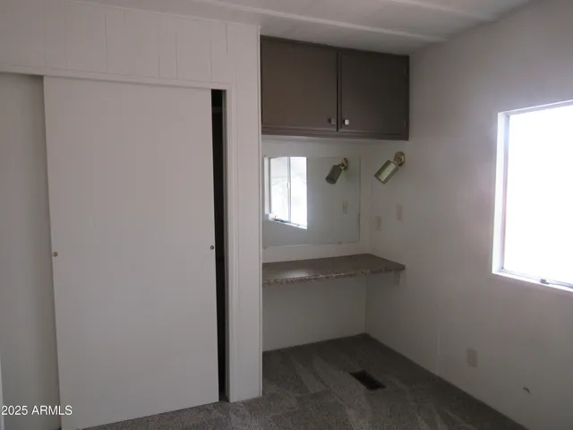 a view of cabinets and window