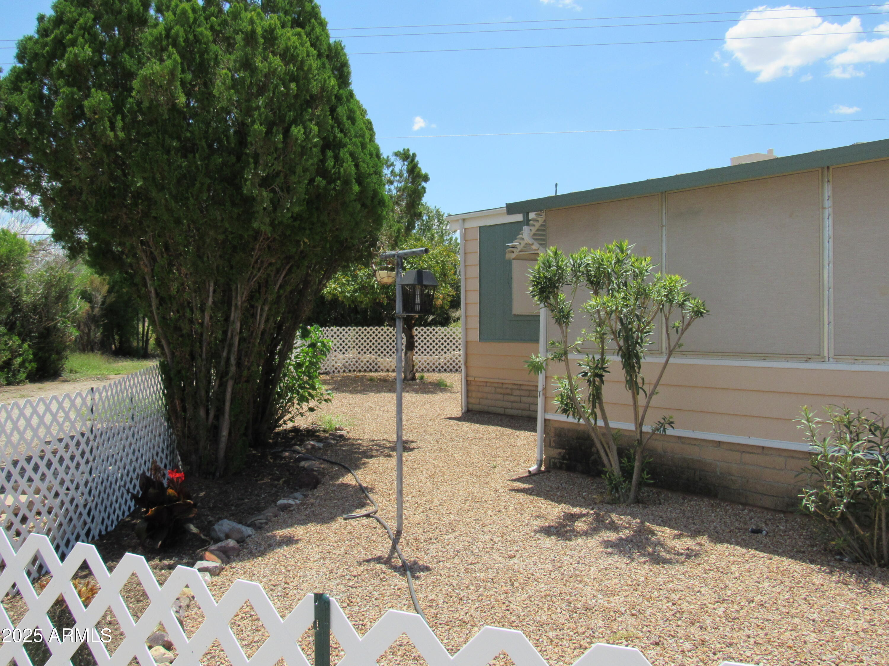 3411 South Camino Seco, Unit 70 Tucson, AZ 85730 - Photo 5 of 22 a view of a backyard