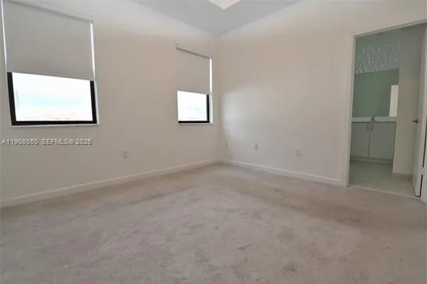 an empty room with windows