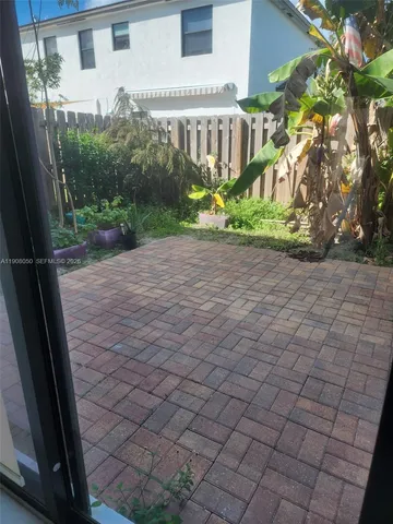 a view of a pathway with a yard