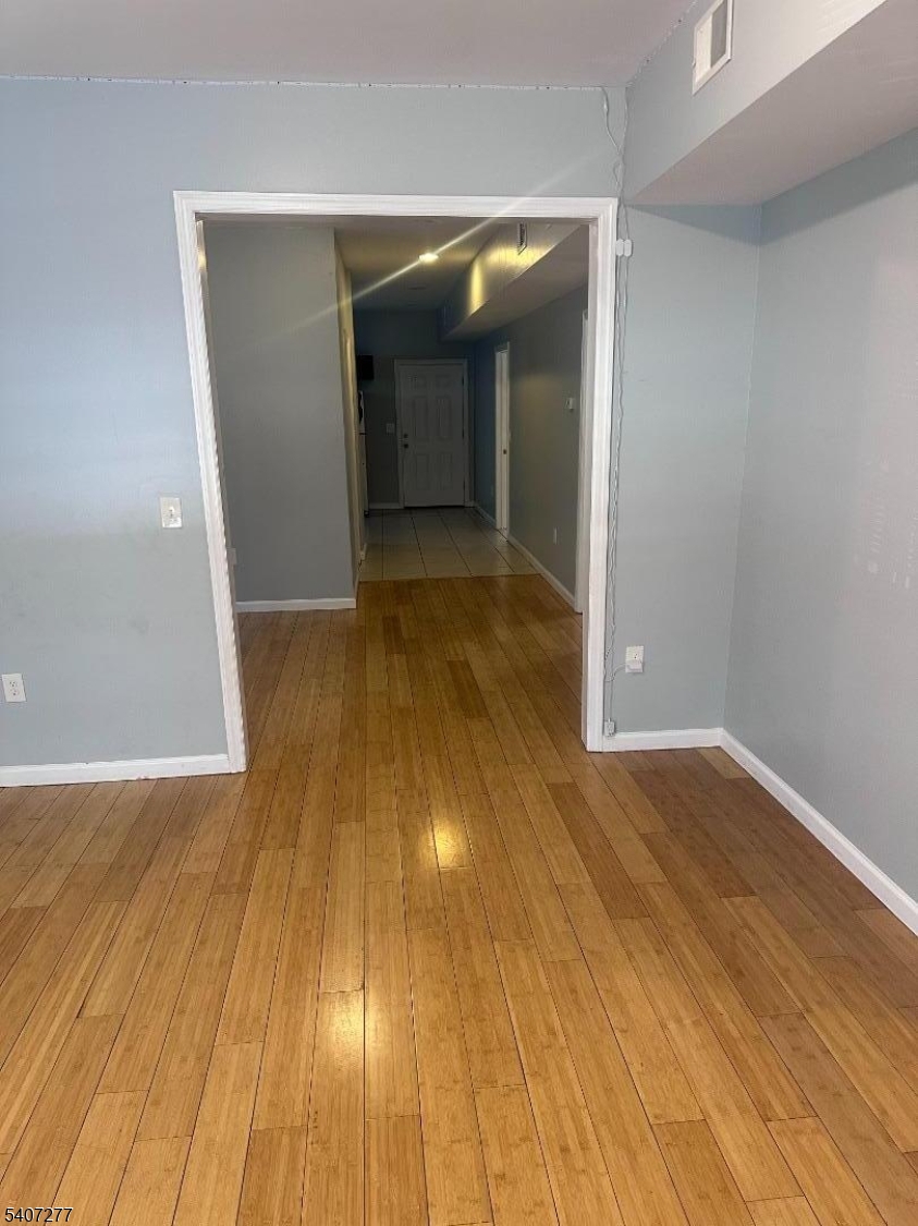 527 South 16th Street Newark, NJ 07103 - Photo 9 of 10 wooden floor in an empty room with wooden floor