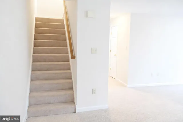 a view of a closet area with white paint