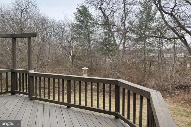 a kitchen with granite countertop a stove a sink and a refrigerator