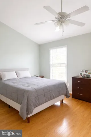 a bedroom with a bed and chair