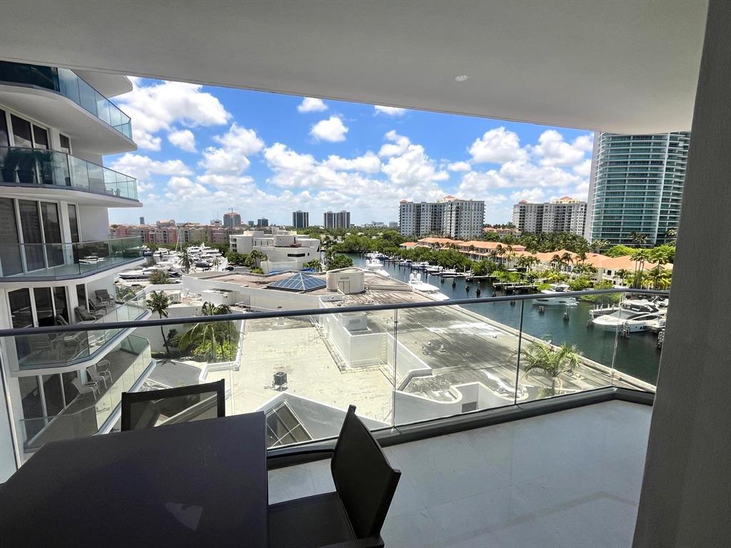 19707 Turnberry Way, Unit 8L Miami, FL 33180 - Photo 22 of 39 a view of swimming pool with outdoor seating and city view