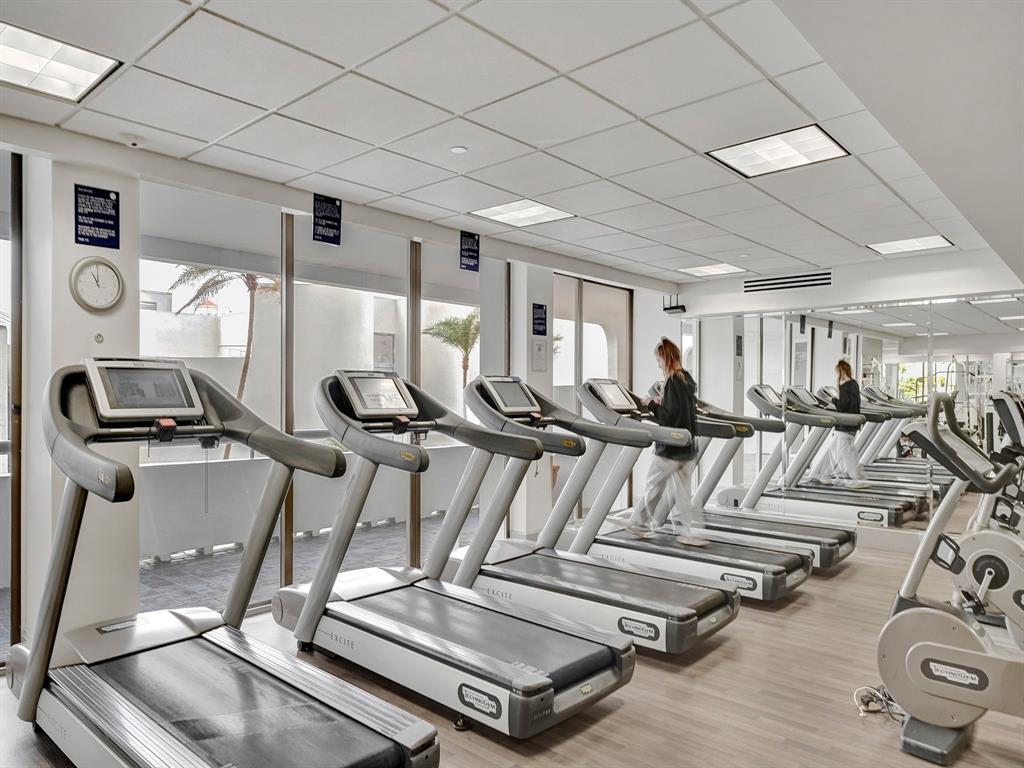 19707 Turnberry Way, Unit 8L Miami, FL 33180 - Photo 34 of 39 a view of a room with gym equipment