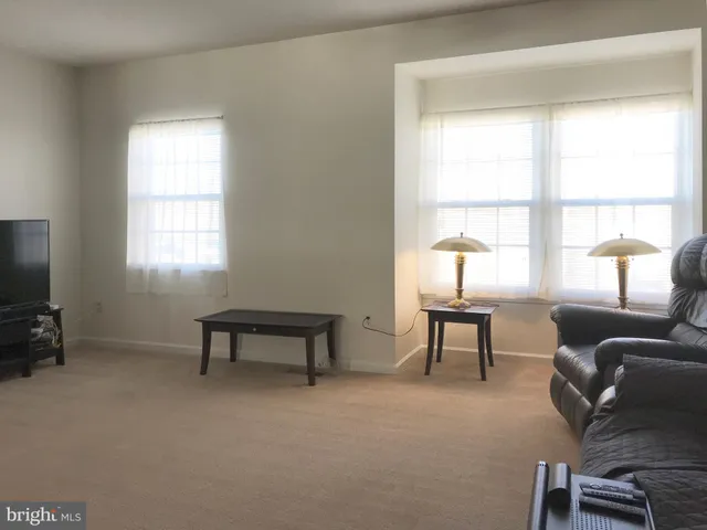 a livingroom with furniture and a window
