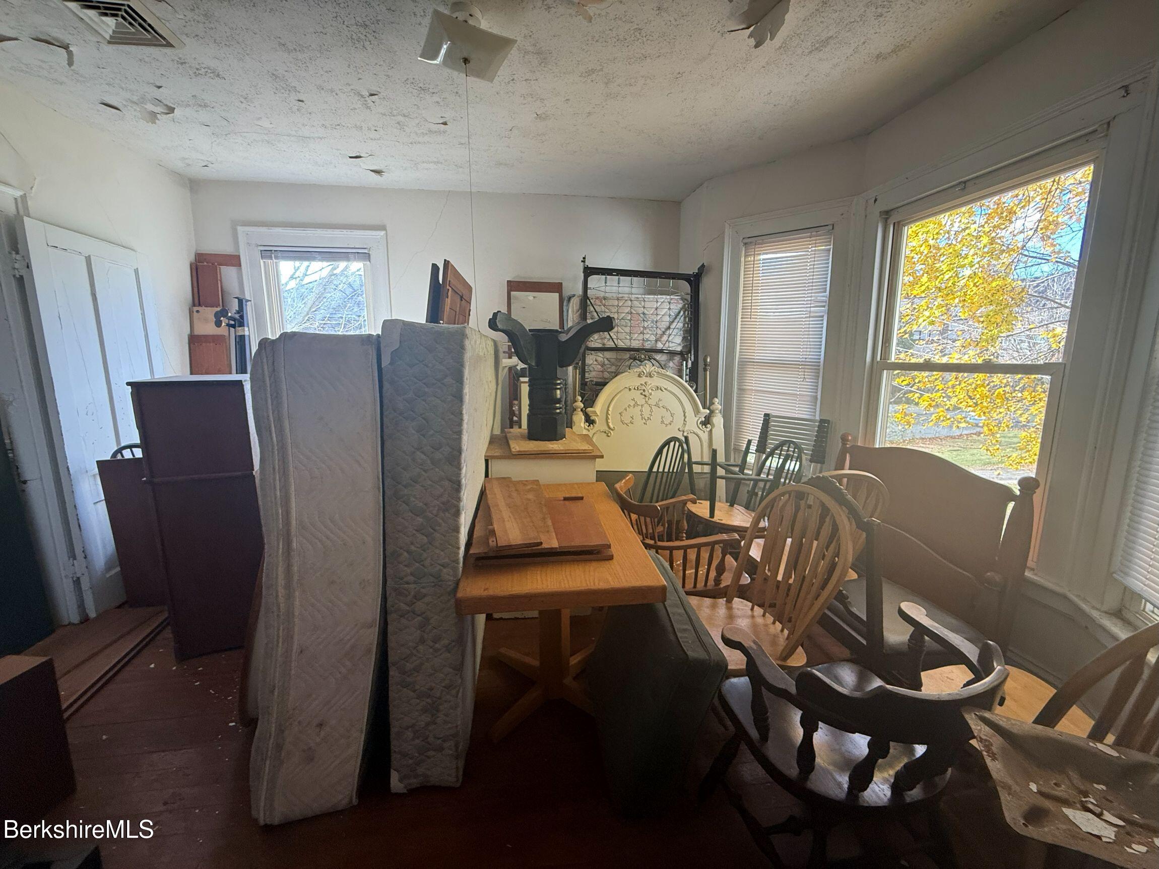 32-38 Spring Street North Adams, MA 01247 - Photo 11 of 32 a view of a dining room with furniture window and outside view