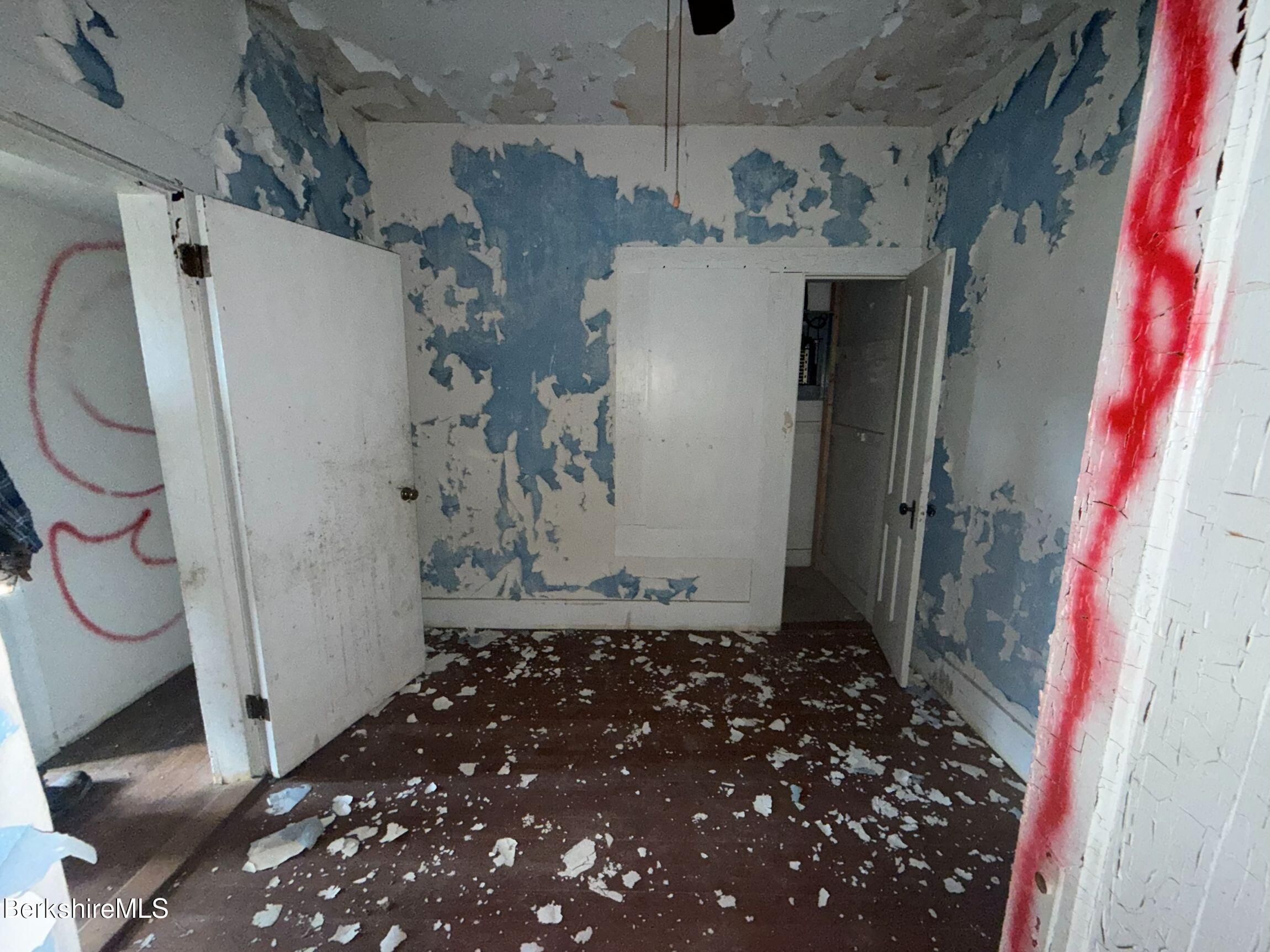 32-38 Spring Street North Adams, MA 01247 - Photo 23 of 32 a bathroom with a granite countertop shower and a sink