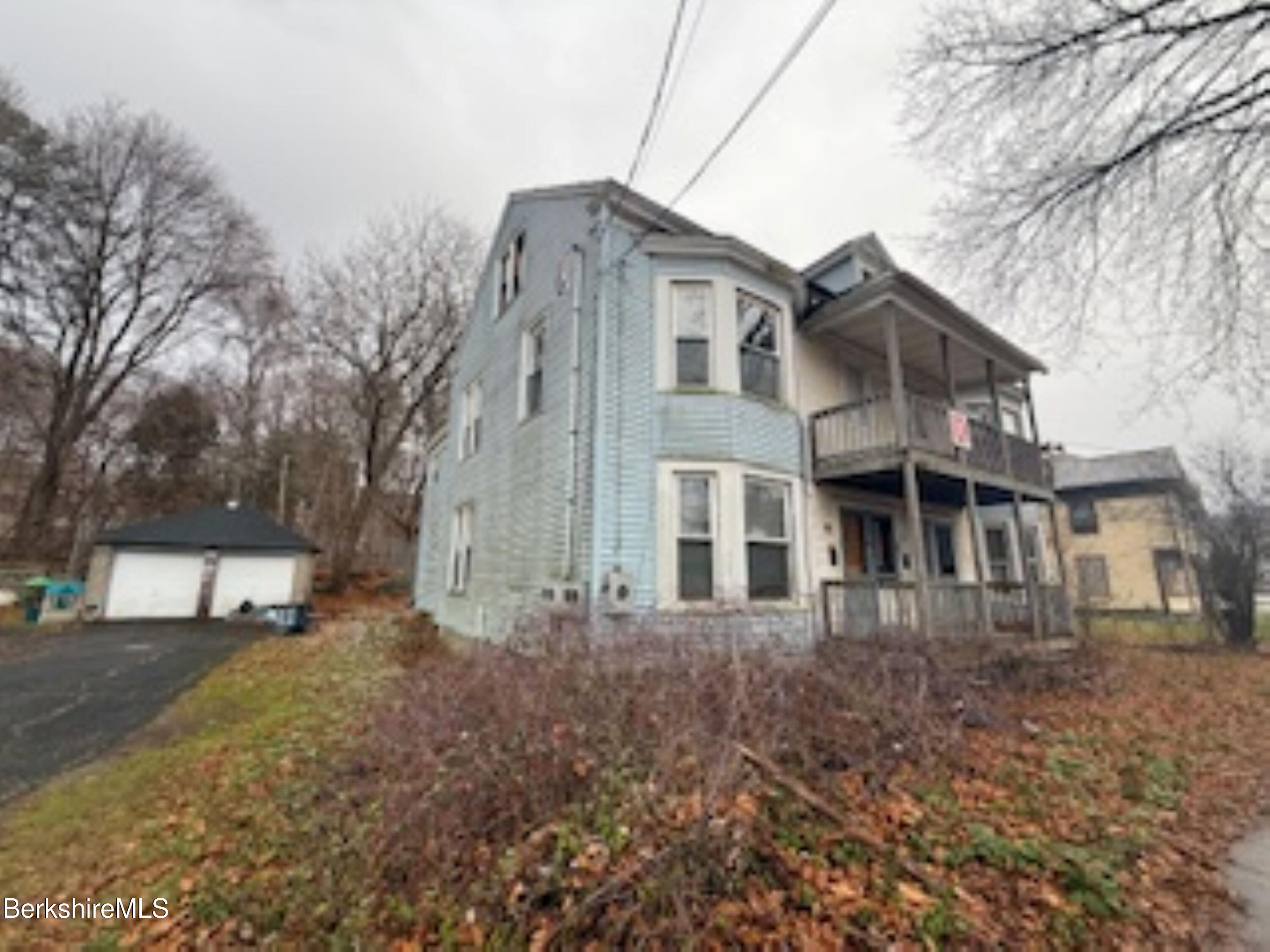 32-38 Spring Street North Adams, MA 01247 - Photo 3 of 32 a front view of a house with a yard